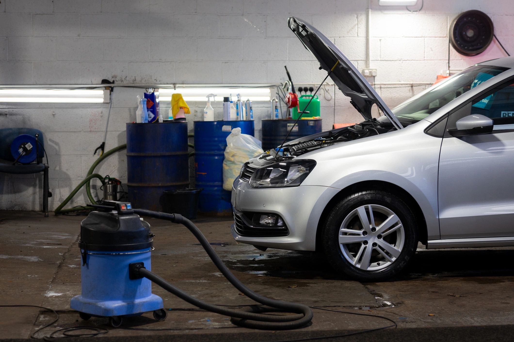 Vehicle in workshop prepared for bodywork and paint refinishing